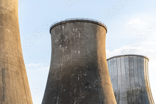 Bild auf Leinwand Concrete cooling towers of an old power plant against a blue sky