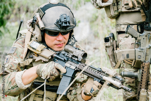 Photography Focused outdoor soldiers in jungle on duty show determination and serious emotio