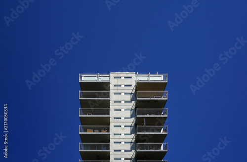 Photography Modern apartment building balconies against deep blue sky in Oslo