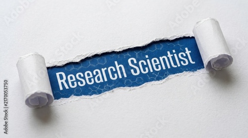 Research Scientist Text Revealed Through Torn White Paper Hole