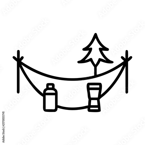 Hammock in calm forest with thermos and travel backpack