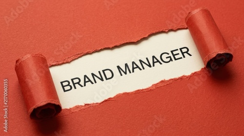 Brand Manager Text Revealed Through Torn Red Paper Background