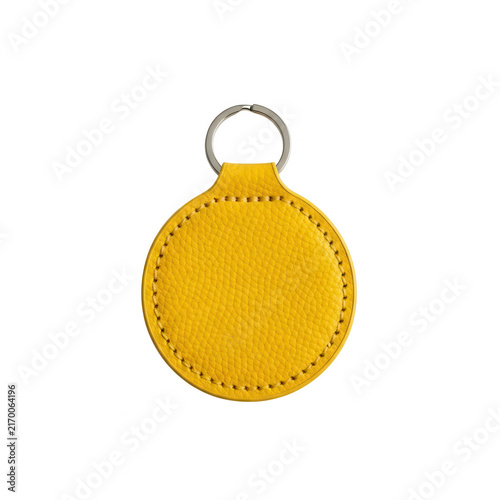 Yellow round leather keychain with metal ring isolated on transparent background for branding and accessory design