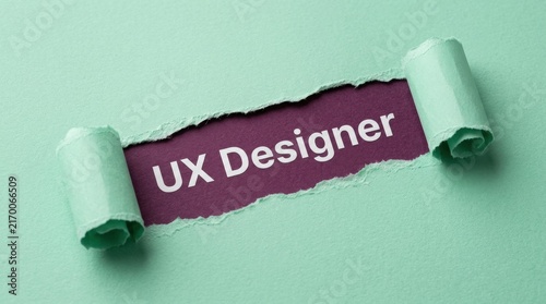 UX Designer Text Revealed Through Torn Green Paper Background