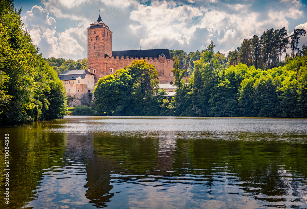Fototapeta premium Stunning summer view of Kost Castle, 14th-century fortress with medieval-style restaurant. Amazing morning cityscape of Podkost village, Czech Republic, Europe. Traveling concept background.