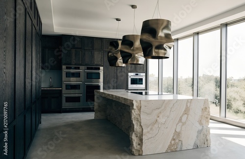 High end kitchen with sculptural stone island and statement pendant lights