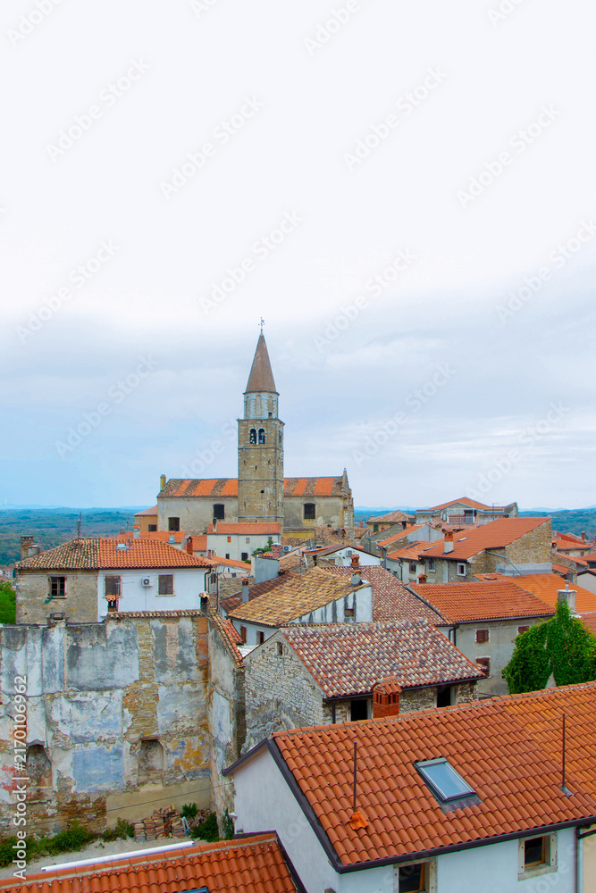 Fototapeta premium Church of Saint Servulus and Old Town Rooftops View in Buje, Istria, Croatia