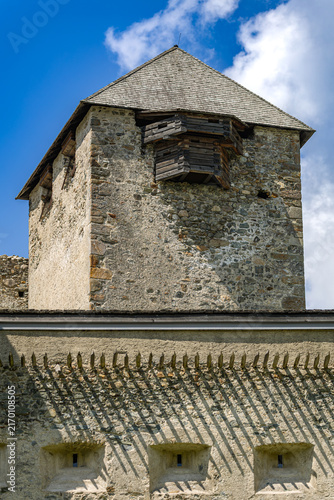 Quadro su tela Vertical detailed view of the square stone keep, wooden balcony bay, and defensi