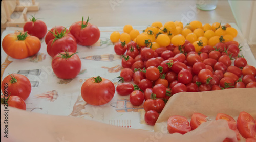 фотографія Abundant colorful tomato harvest on table
