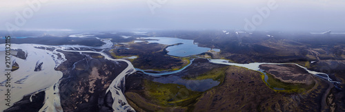 Фотография Aerial view of braided glacial rivers and lakes in Rangarthing ytra, Iceland