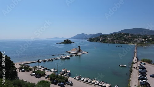 4K static timelapse capturing activity on planespotting causeway with boat passing near Corfu Airport, Greece