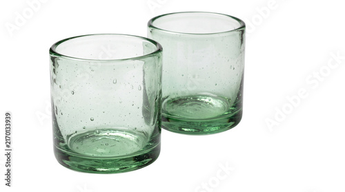 Handcrafted recycled glass tumblers, pair of rustic green drinking glasses with bubble texture, artisanal glassware set isolated PNG with Transparent Background
