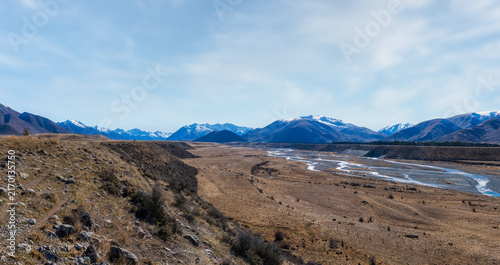 Surrounded by mountain ranges the extreme arid dry farming fields in the Ahuriri conservation valley area  in Canterbury NZ