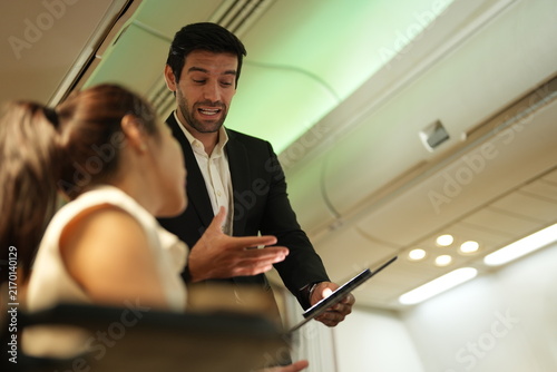 Obraz na płótnie A bearded man and a young woman on board settle into a long conversation in the