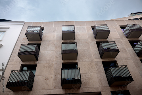 Canvas Print Hamburg, Germany - July 1, 2026: Modern apartment building with projecting black metal balconies in Hamburg, Germany