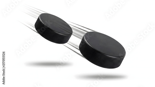 Two Black Hockey Round in Motion