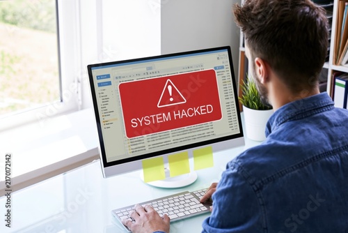 Hacked computer screen showing a cybersecurity alert warning of a security breach