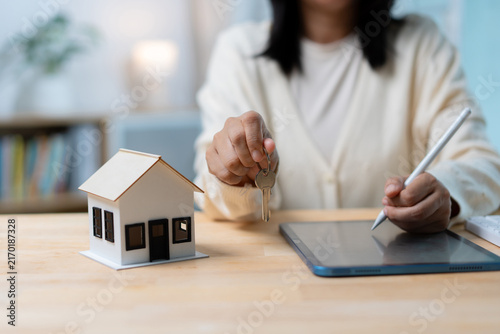Konstfotografi Home Buying and Real Estate Ownership Concept with House Model and Key