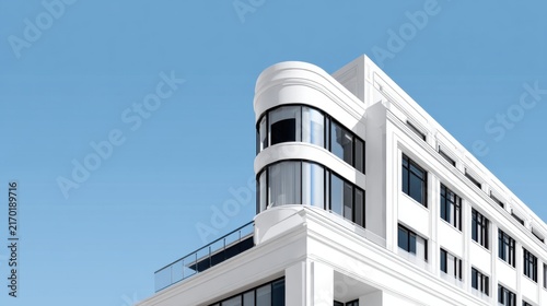 Modern Architectural Building with Clean Lines and Blue Sky Background
