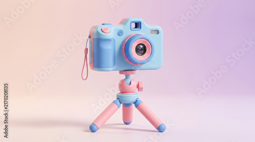 Pastel toy camera on mini tripod in studio setting for product photography.