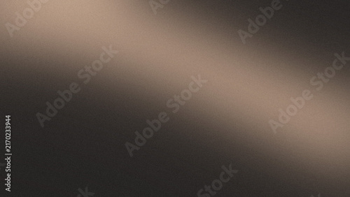 Foto Light brown textured background with bright diagonal light and fine grain detail