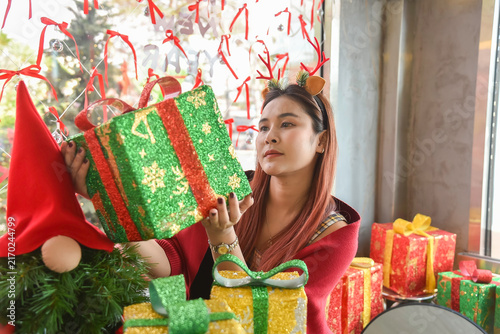 Happy woman in red sweater holding many boxes, Gift box in female hands. Holiday, gift, Holiday gift surprise, Merry Christmas and Happy new year season.