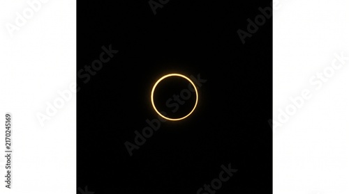 Annular solar eclipse with beautiful golden corona ring of fire in dark sky
