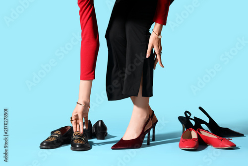 Fotografie Fashion choice and personal style, woman selecting shoes for outfit, footwear co