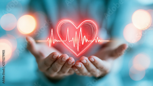 Hands holding a glowing red heart with an ECG heartbeat line, symbolizing health and care.