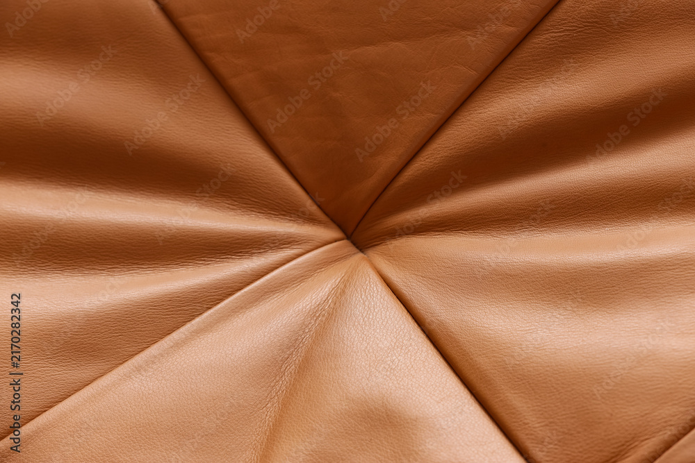 Obraz premium Luxury leather texture and material background, abstract pattern with soft folds and natural wrinkles, close up of brown upholstery
