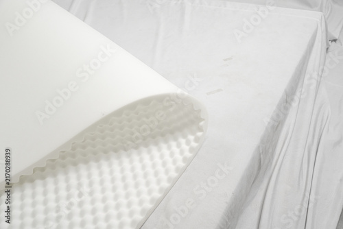 фотографія Close-up of white convoluted egg crate foam topper layer for mattress, bedding m
