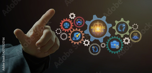 Obraz na płótnie Businessman open hands framing glowing gear mechanism displaying Business Ethics central text