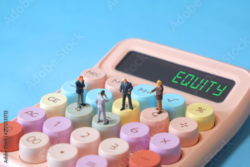 Group of miniature businessmen standing on calculator with EQUITY text on digital screen, business ownership concept