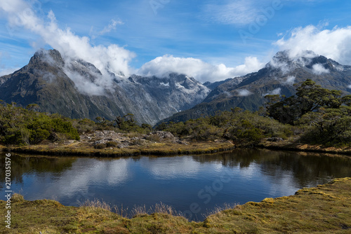The alpine tarn at the top of The Key Summit, part of the Routeburn Track in New Zealand's Fiordland National Park, has an elevation of 918 meters (3,012 feet)