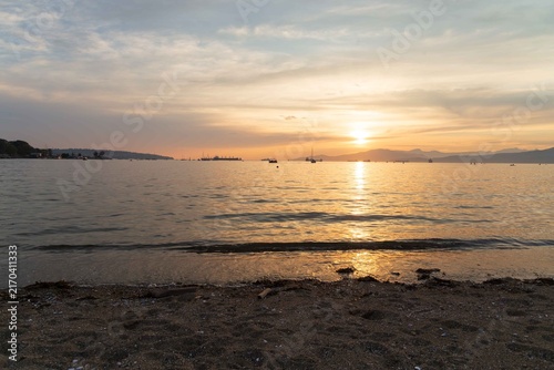 A Sunset view from Sunset Beach, Vancouver, British Columbia. Showing boats and ships in English Bay 