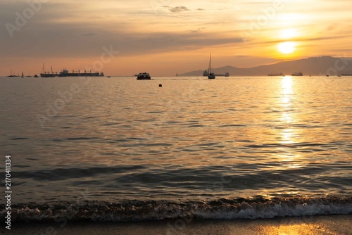 A Sunset view from Sunset Beach, Vancouver, British Columbia. Showing boats and ships in English Bay 