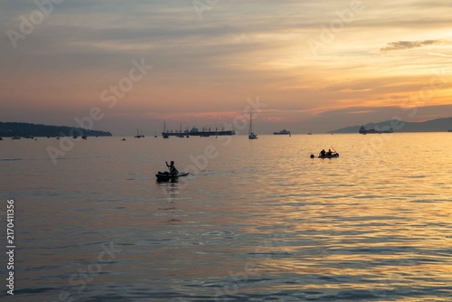 A Sunset view from Sunset Beach, Vancouver, British Columbia. Showing boats and ships in English Bay 