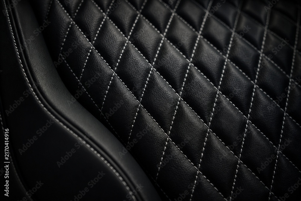 Fototapeta premium Quilted leather seat featuring diamond stitching in interior