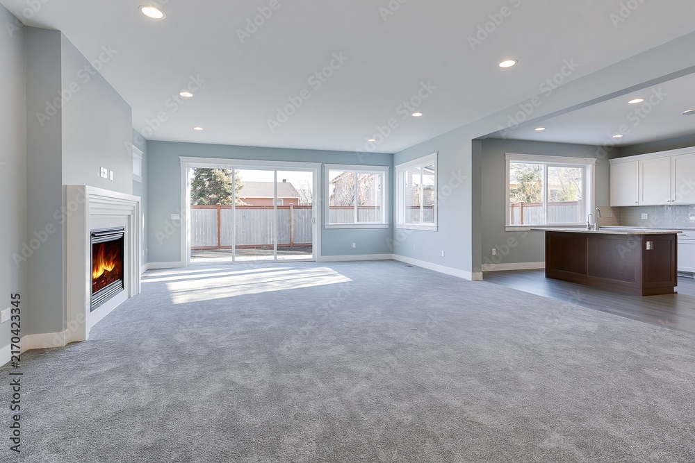Naklejka premium The Modern Open Living Room With Fireplace And Kitchen Island