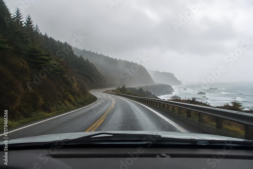 windshield view of rainy pacific northwest coastal highway