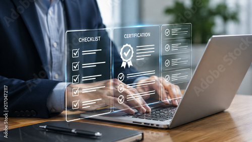 Businessman using laptop with digital checklist and certification interface.