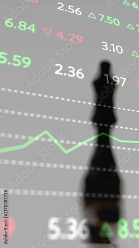 Stock market data animation over chess pieces on reflective surface