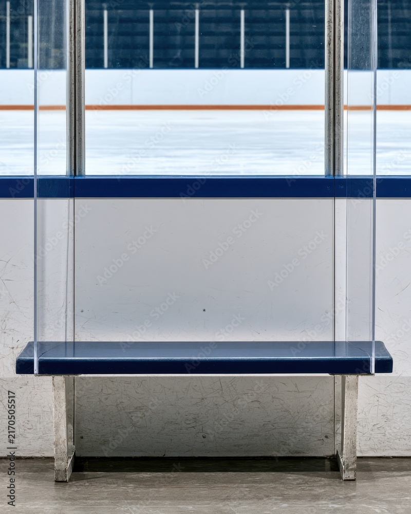 Fototapeta premium Empty ice hockey rink view through protective glass with blue trim for sports design poster background