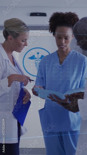 Animation of heart rate montior against diverse doctors and health worker discussing at hospital