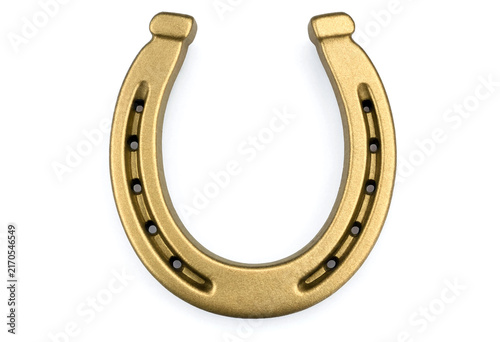 Golden horseshoe charm with nail holes isolated for rustic and equestrian themes