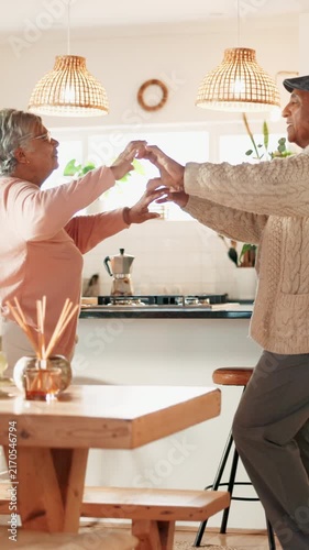 Dancing, happy and senior couple in kitchen at house listening to music, radio or song together. Smile, love and elderly man with woman moving to album for bonding, connection or marriage in home.