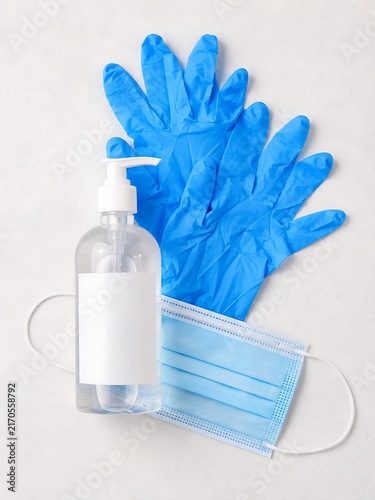 Personal protective equipment kit featuring antibacterial gel and face mask for virus prevention.
