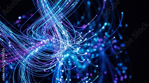Abstract background featuring glowing blue and purple fiber optic cables creating a futuristic data stream visualization with bokeh light particles and high speed network communication conce