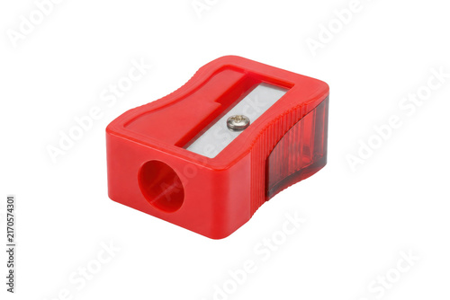 Cuadro en lienzo Vibrant red plastic pencil sharpener with a metal blade and transparent shaving