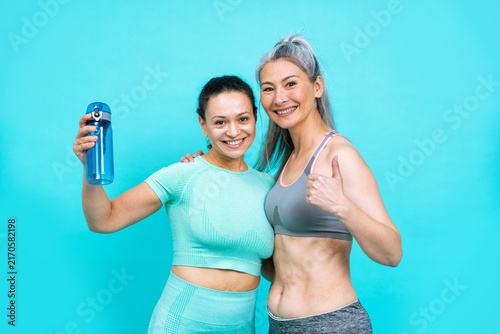 Image of two women with different body  age  and ethnicity making sport